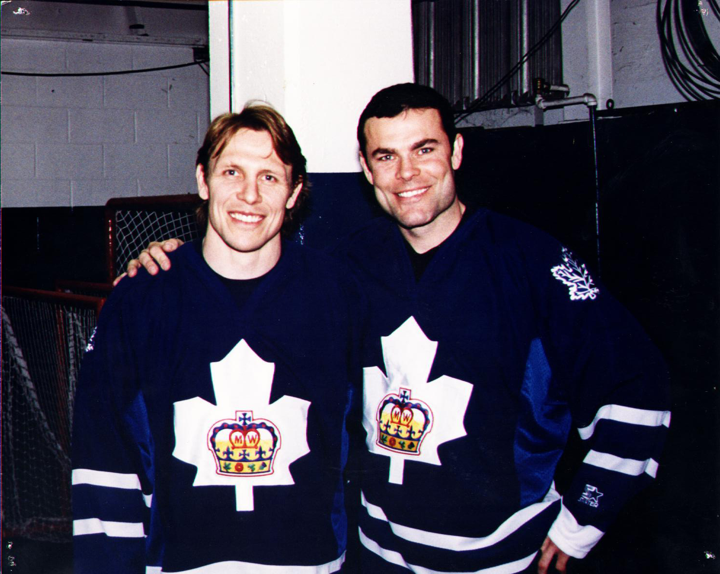 On the eve of Markham retiring his sweater number 10, Adam Oates is reunited with old linemate Steve Thomas after a practice in Toronto. The two are wearing the 1999 version of the Waxer sweater.