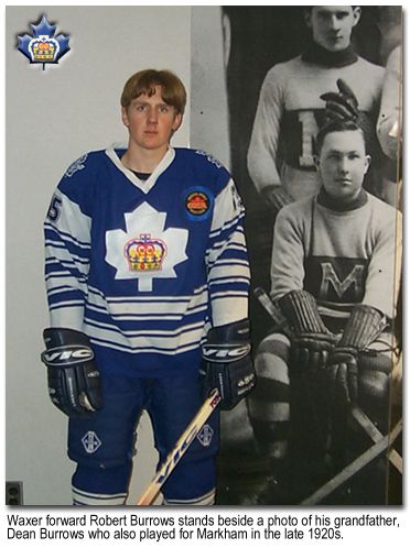 Rob Burrows beside photo of grandfather Dean Burrows